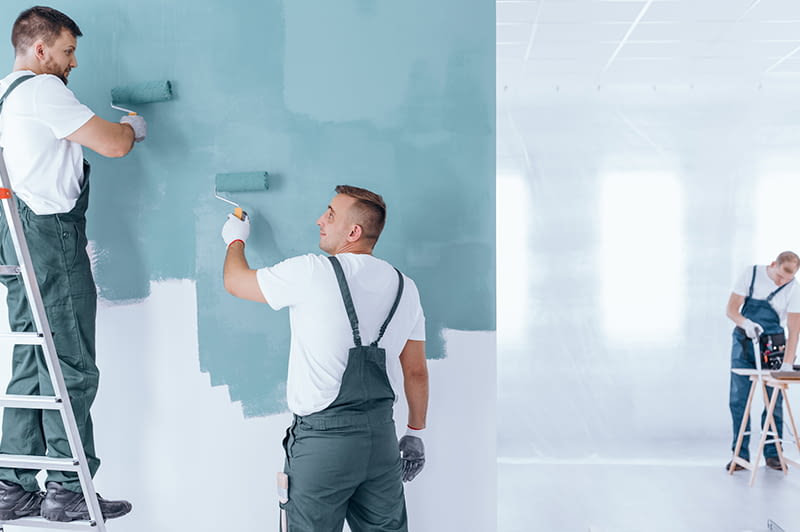 pintores profesionales pintando pared