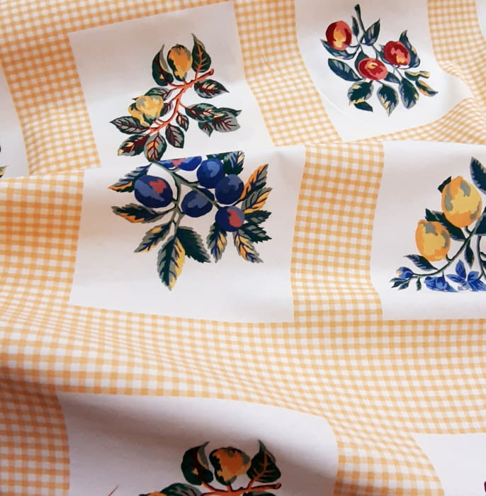 Tela algodón frutas amarillo