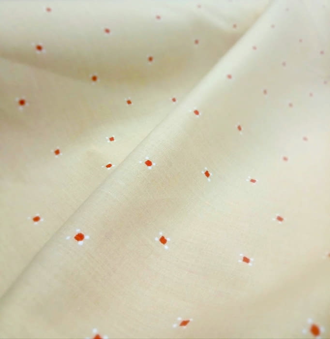 Tela amarilla topitos naranjas 260