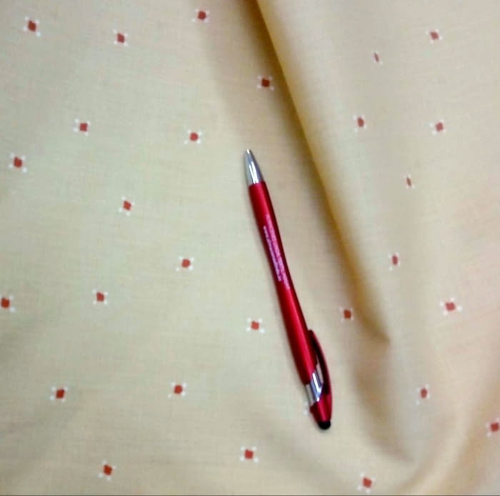 Tela amarilla topitos naranjas 260 - 1