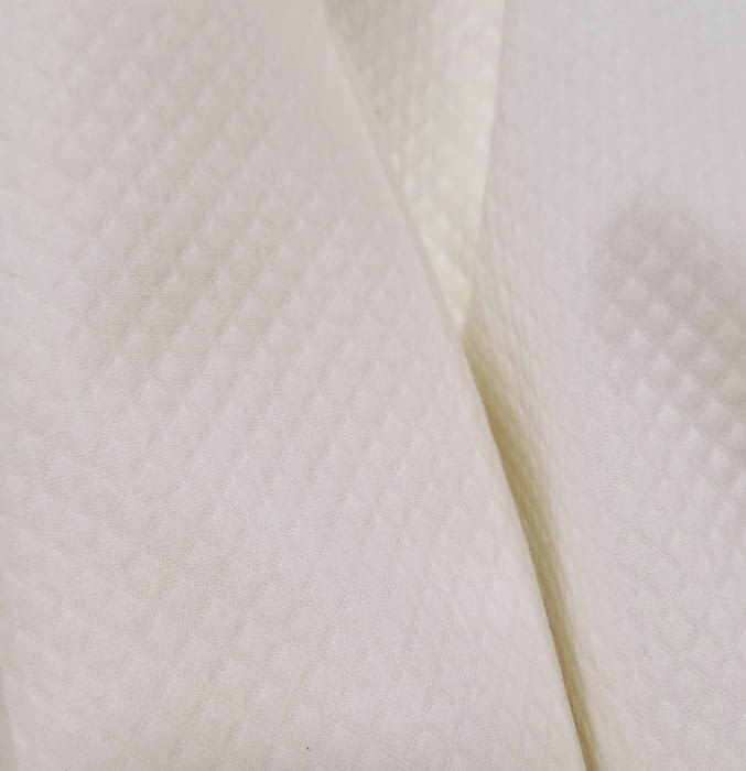 Tela piqué rombito crudo
