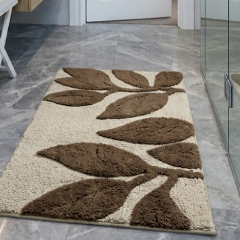 Alfombra de baño beige con hojas marrones - 1