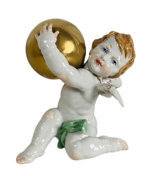 Ángel con una bola dorada de la marca Algora.