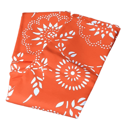 Colchas multiusos naranjas con dibujos blancos. - 2