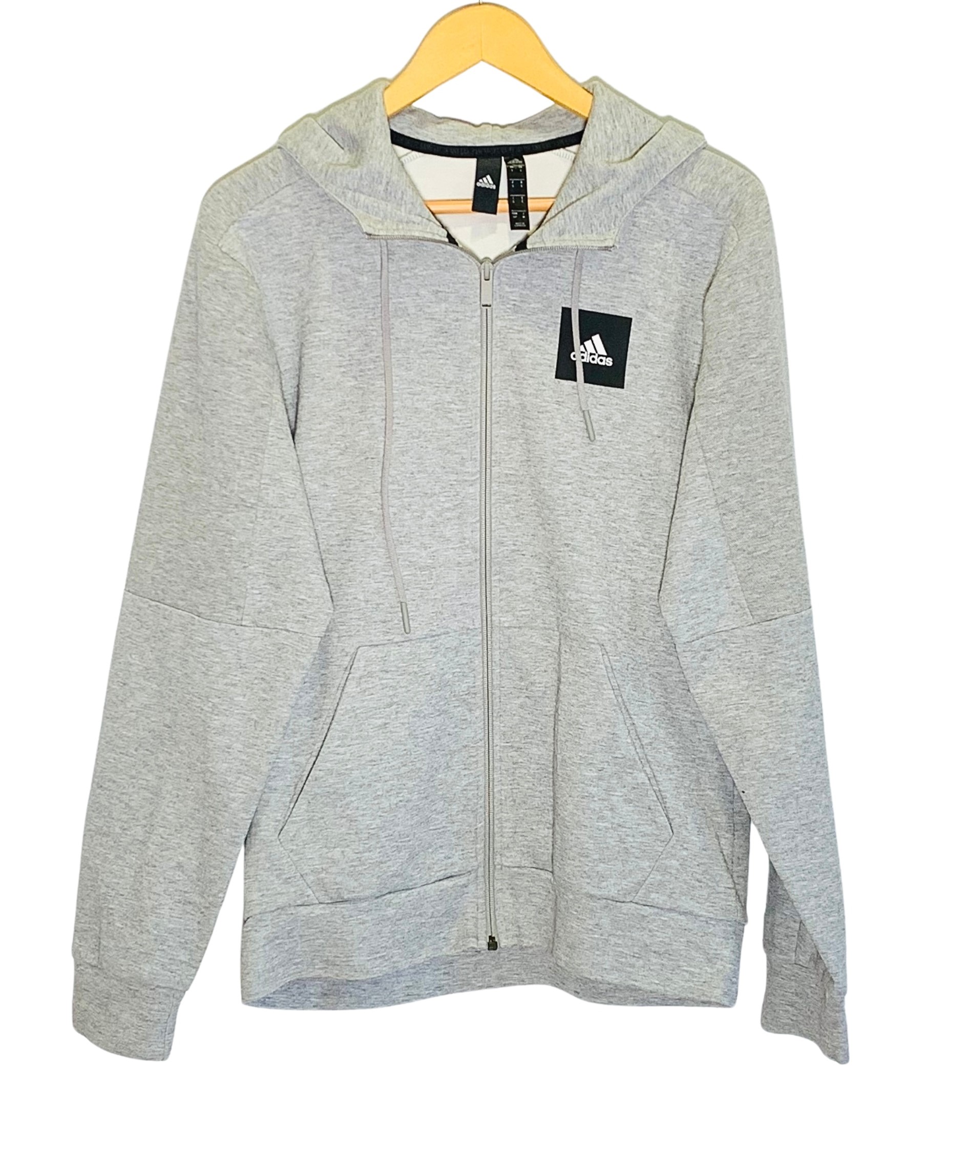 Jaqueta xandall Adidas de color gris clar amb caputxa