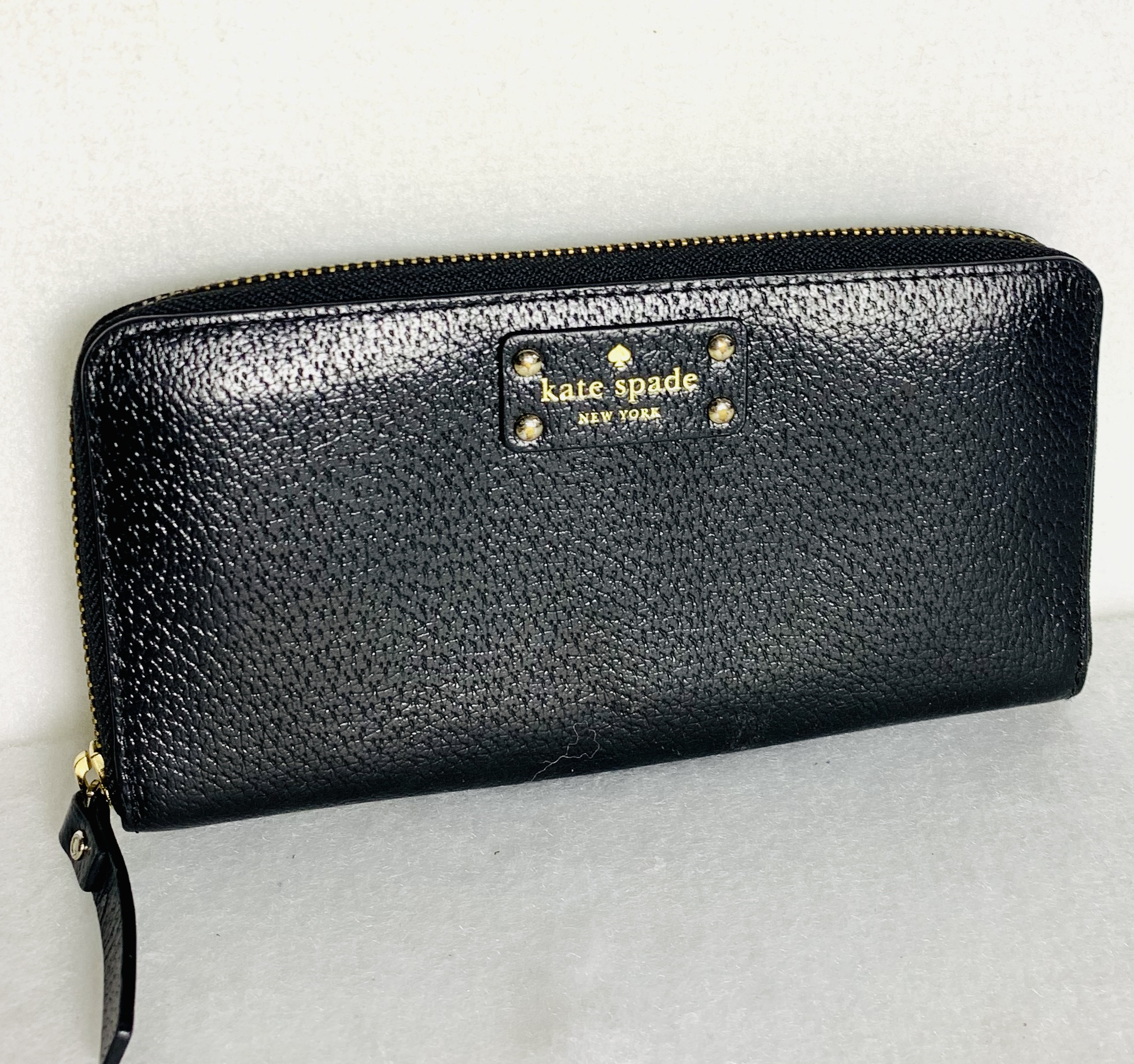 Monedero kate spade de piel grande